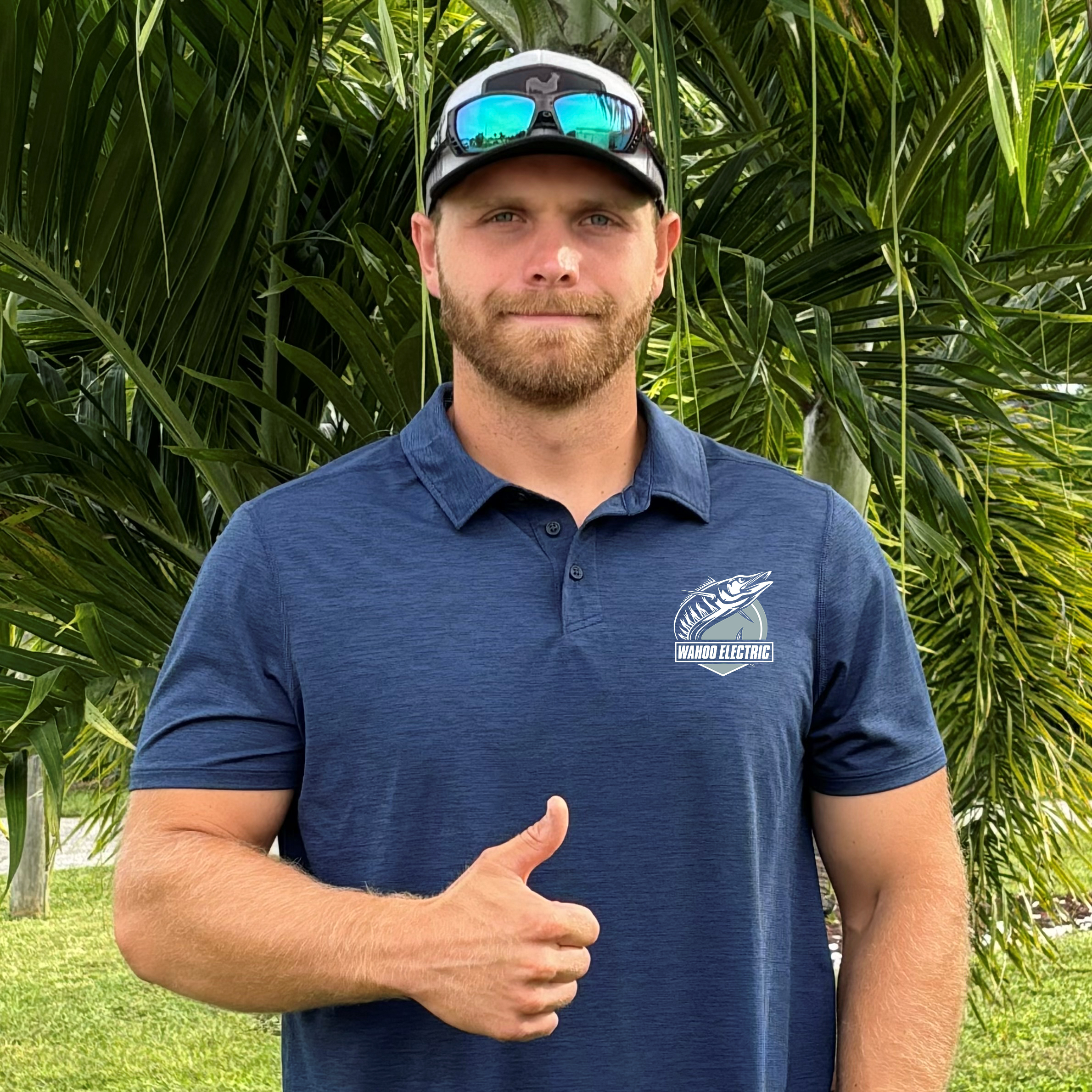 Photo of Wahoo Electric's Owner, Eric. He is smiling and giving you a thumbs up!